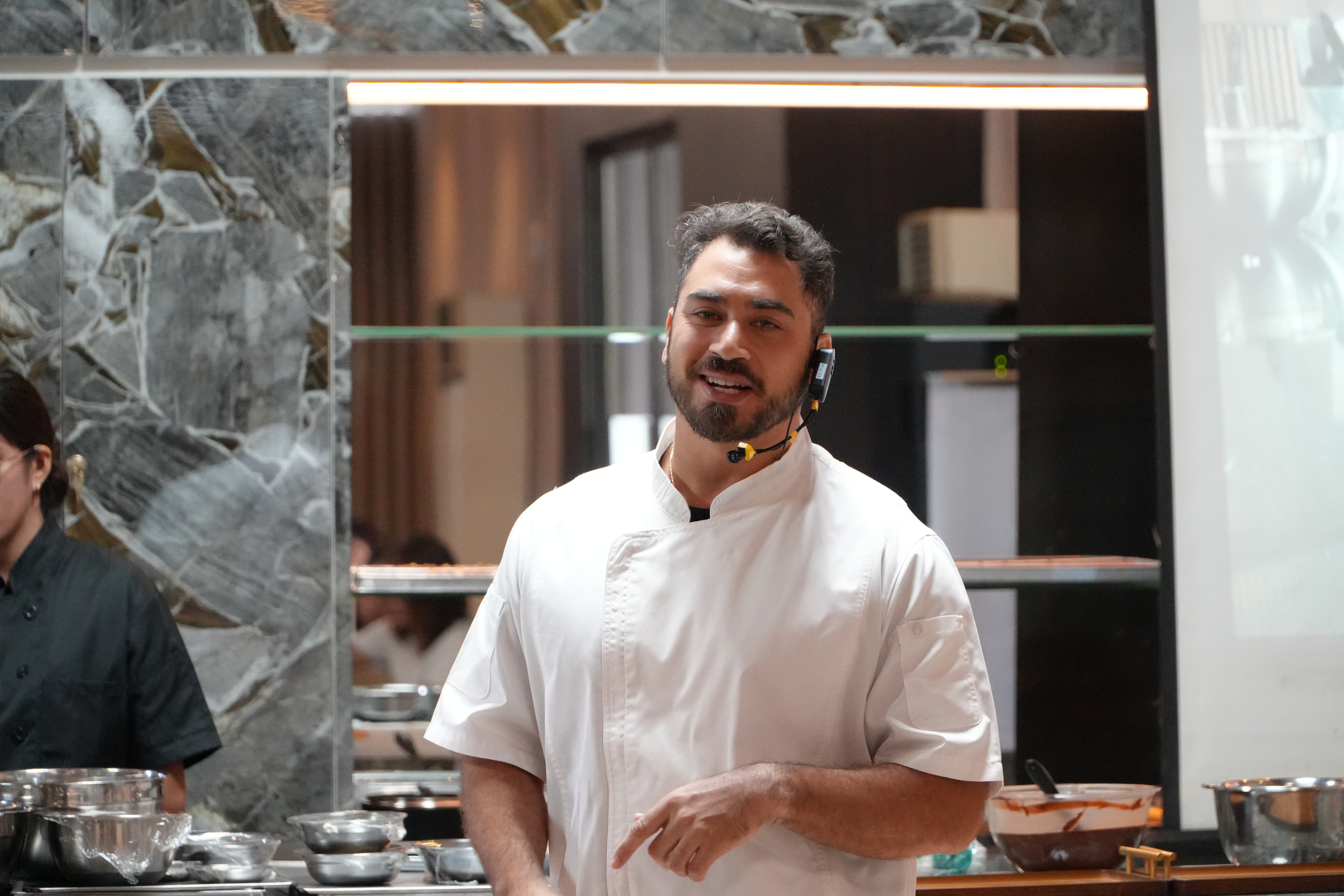 Chef Christian Valdes, master chocolatier portrait shoot wearing white chef jacket