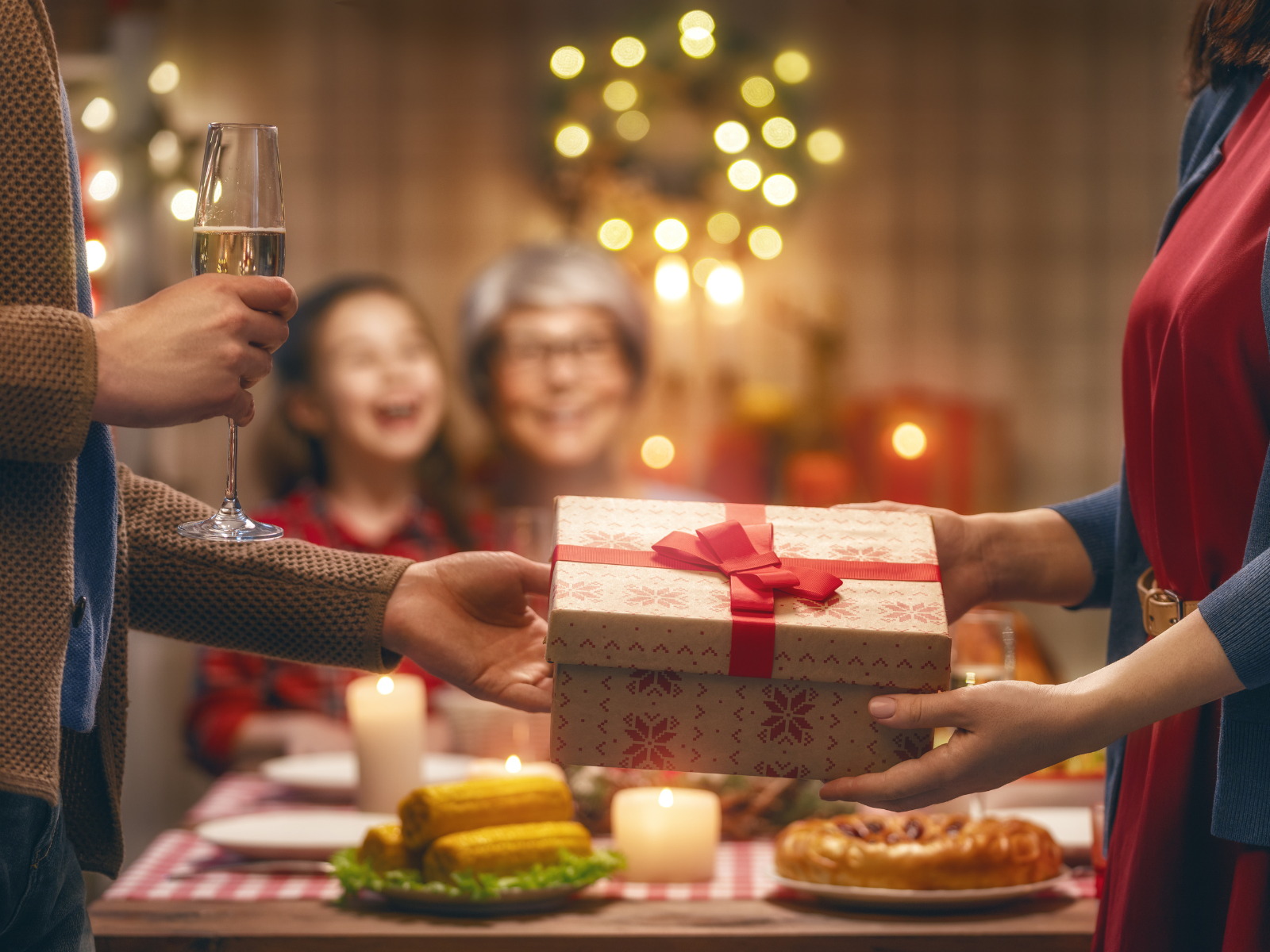 Family celebrating Christmas, giving gifts